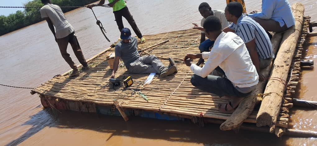 Tilaye crossing the river to conduct the bathymetry survey for the river cross section 