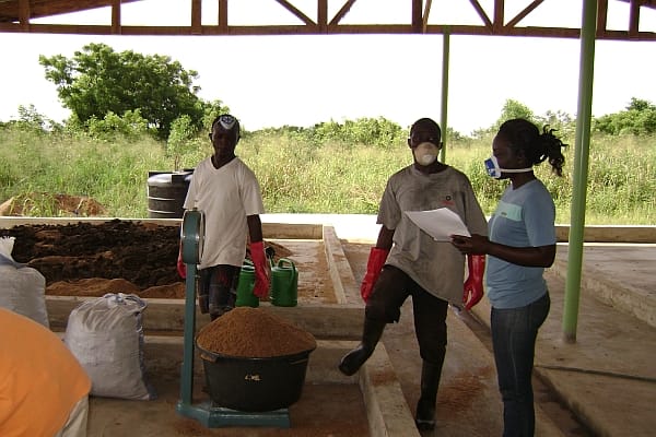 Ghana. Workers prepare compost samples of Fortifer, a pathongen-free organic fertilizer made using enhanced fecal waste. The pilot project is the first in West Africa under an innovative waste-to-food business model. Laboratory analysis in Ghana shows that Fortifer is a safe product and can improve agricultural yields by 20 percent to 50 percent compared with the use of inorganic fertilizers, while also maintaining soil health. Photo: Josiane Nikiema