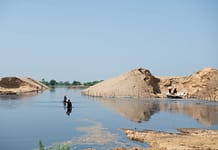 Villagers in Pakistan push through floodwaters