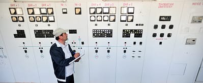 An engineer checks machinery at a water pumping station in northern Tajikistan, near the border with Uzbekistan. Photo: Neil Palmer for IWMI.