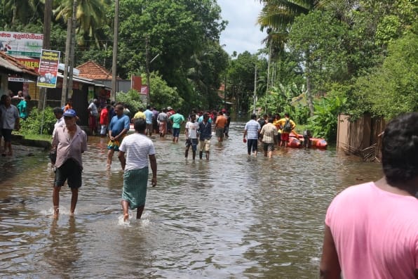 Locals gathered on the road in need of relief and support. Photo: IWMI.