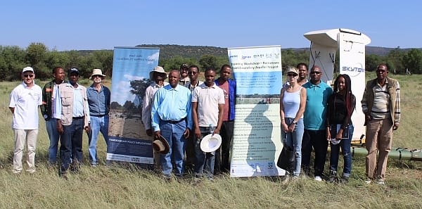 Group photo in front of the SkyTEM system