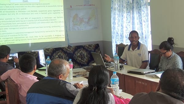 IWMI researchers Ambika Khadka and Romulus Okwany present and discuss their field data with the implementation unit