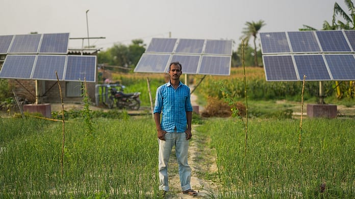 Farmer Yatin Kumar in front of his solar irrigation pump site. Photo: Metro Media / IWMI