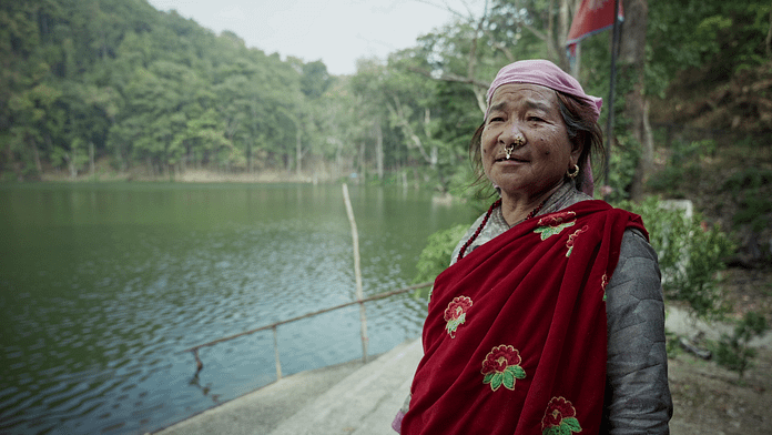 Kheema Devi Rana, a farmer from Alital, Nepal, explaining how development benefits some communities while displacing others. Photo: Aayush Niroula/IWMI