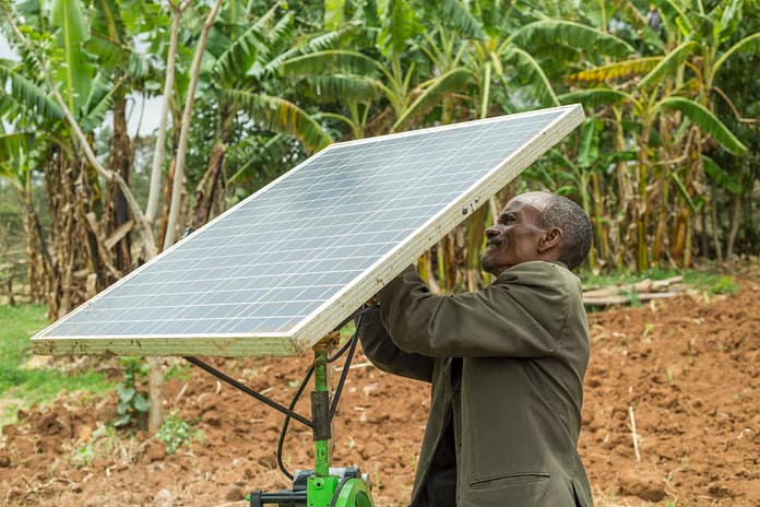 Farmer in Ethiopia with the solar pump he received from IWMI. Photo: Maheder Haileselassie / IWMI