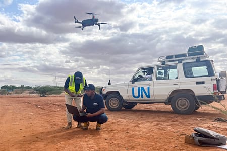 IWMI team in Dolo Ado flying the drone Ousman, Tilaye and Mitchell calibrating and piloting the drone. Photo: IWMI