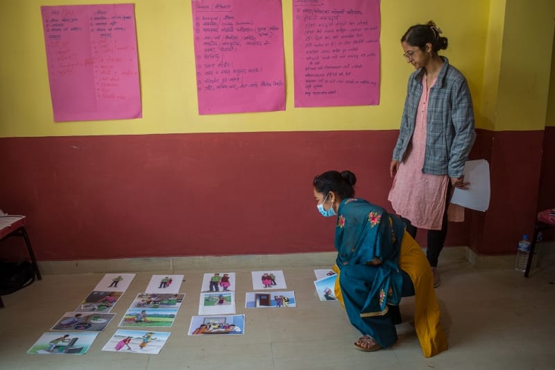 Krishna Kumarai Shrestha, WASH Supervisor from Everest Club, Dailekh, places the picture depicting money borrowing under the bar of mostly women led work as she reckons that currently, economic activities are engaged in by more females due to the massive male-out migration. In this Gender Position Bar activity, participants reflect on the role and responsibilities carried out by males and females and their reasoning behind that.