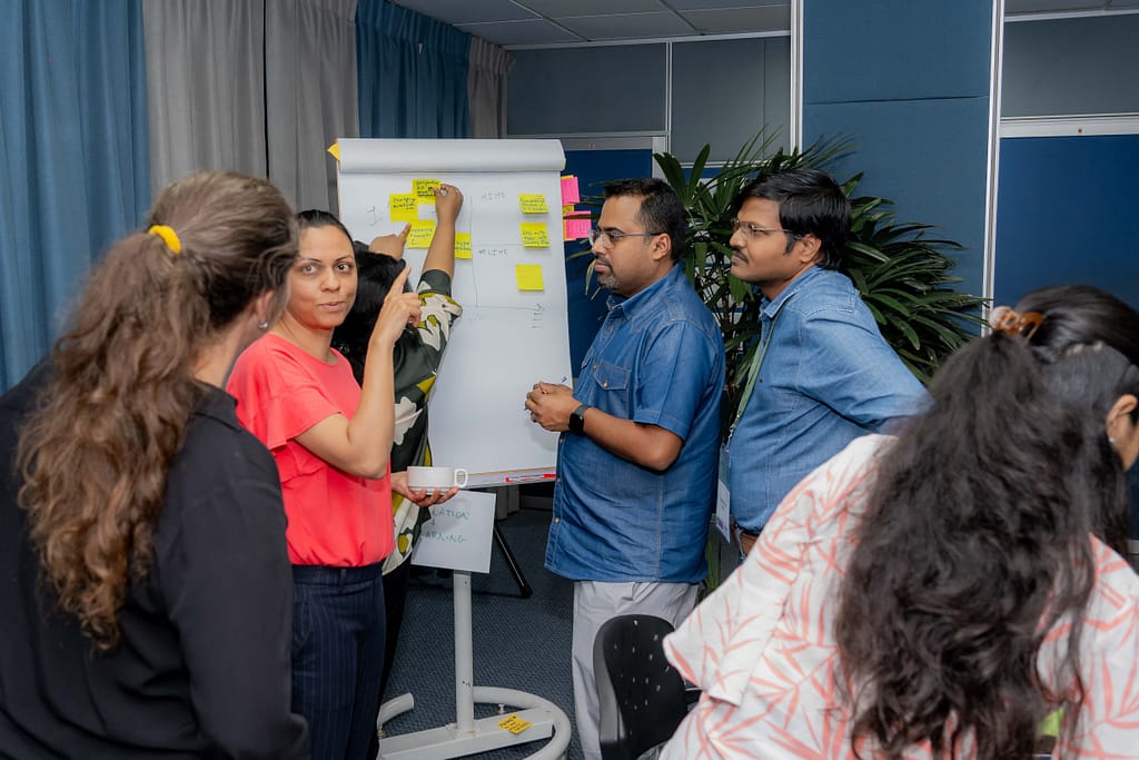 Participants discuss tradeoffs between the level of effort and the level of reward for various innovations. Photo: Gunarathna Thisal/ Mantaray Films