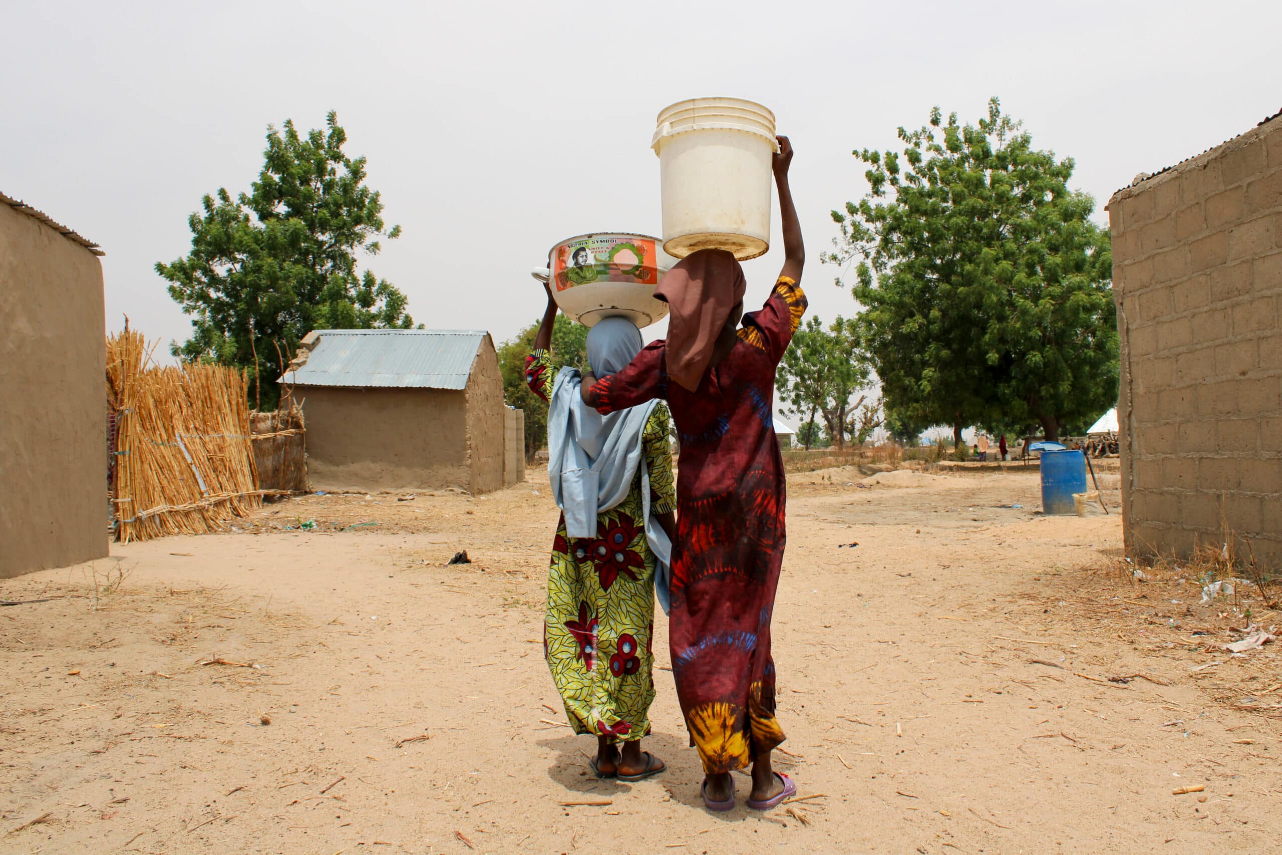 Girls returning home from fetching water from a well. Sangere, Nigeria. Photo: Rachael Michael