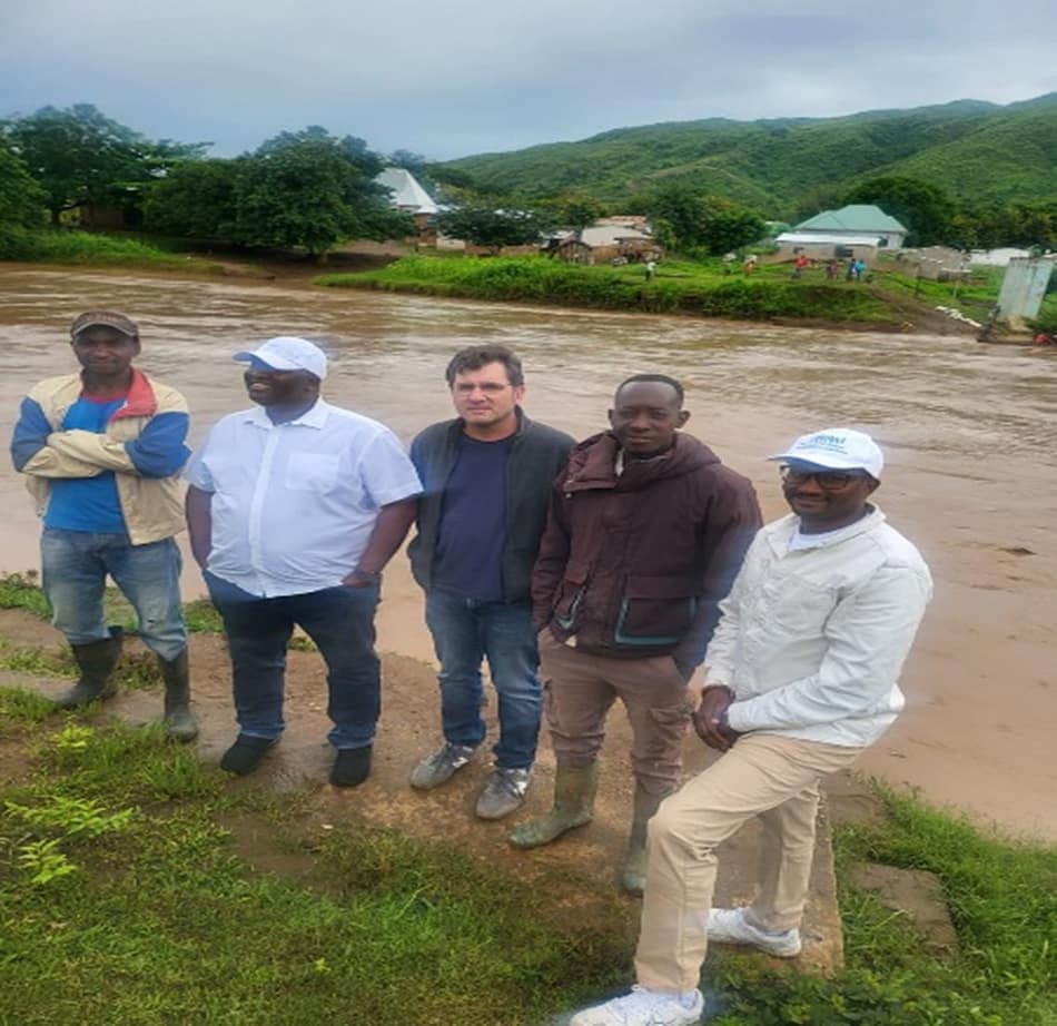 Standing on the banks of the Tanzanian side of the Songwe River, near Kyela. Homes in the top of the image are in Malawi. Photo: Yakob Umer / IWMI