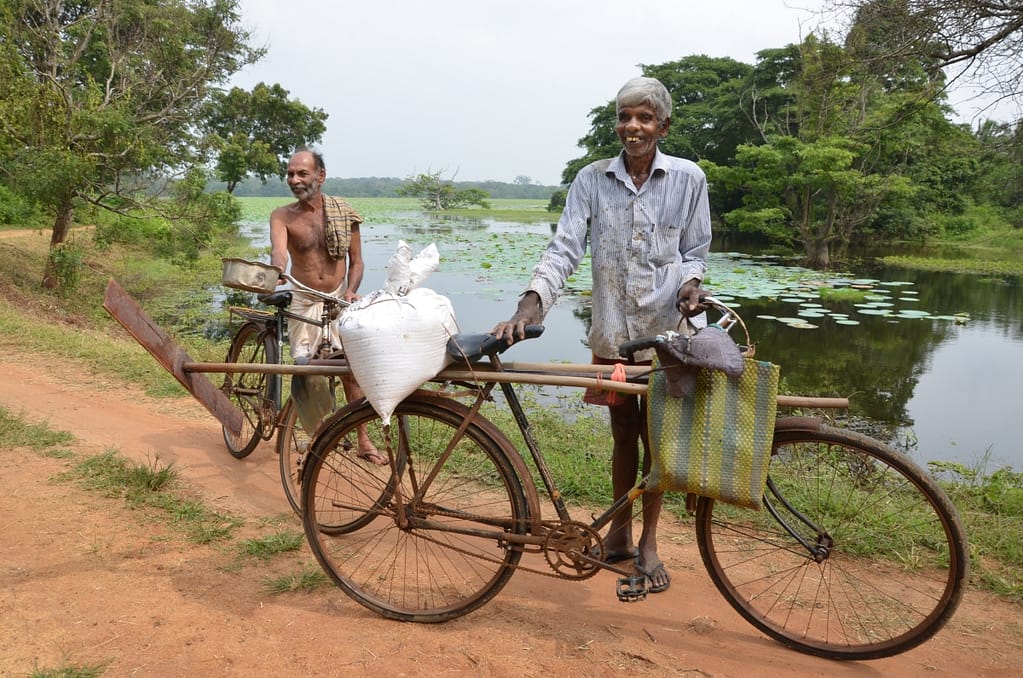 Two slash and burn farmers, Saranapala (left) and Ariyarathna, who utilize water from the Thirappana tank, belonging to the Malwathu Oya River Basin