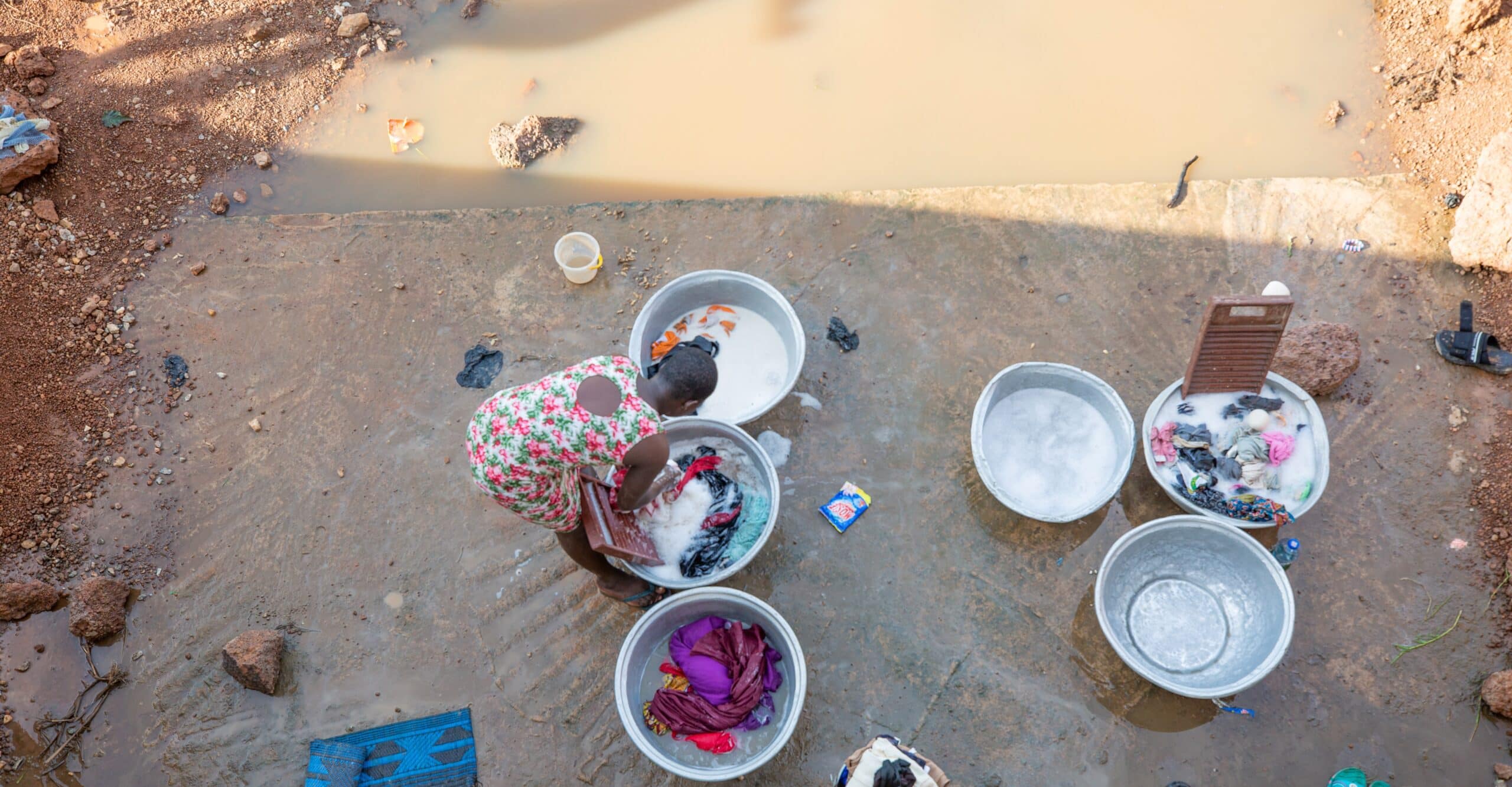 Woman washing water in stagnant water