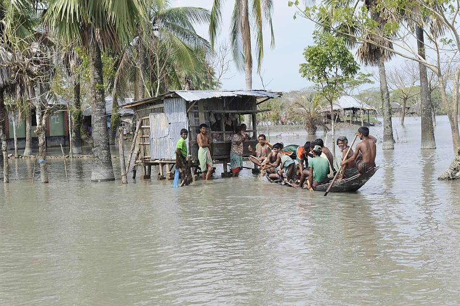 Streets in Satkhira, Bangladesh are flooded after months of heavy rain. Residents of the area are forced to travel by boat to the local shops. DFID/Rafiqur Rahman Raqu