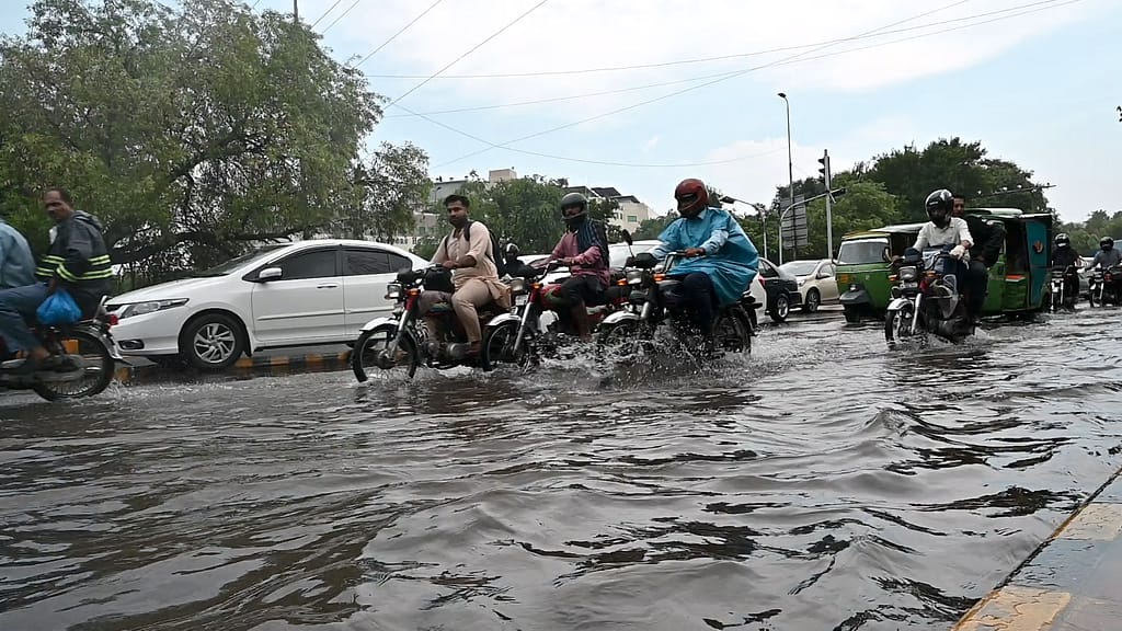 A single monsoon downpour this season leaves Lahore’s roads submerged, slowing motorists to a crawl.