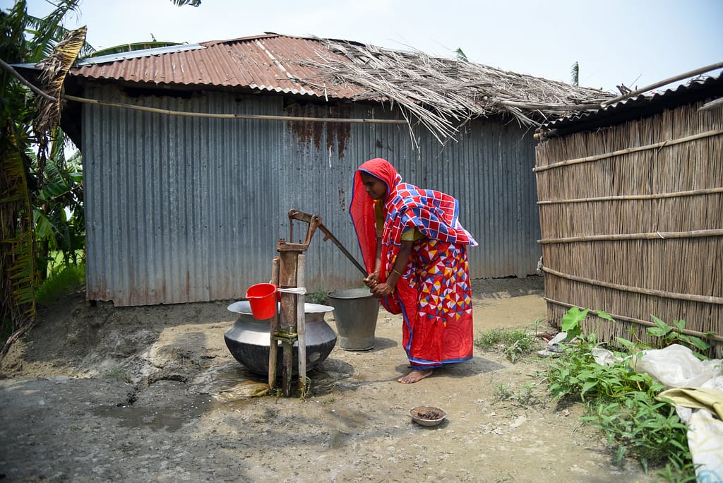 Woman Bangladesh collecting water