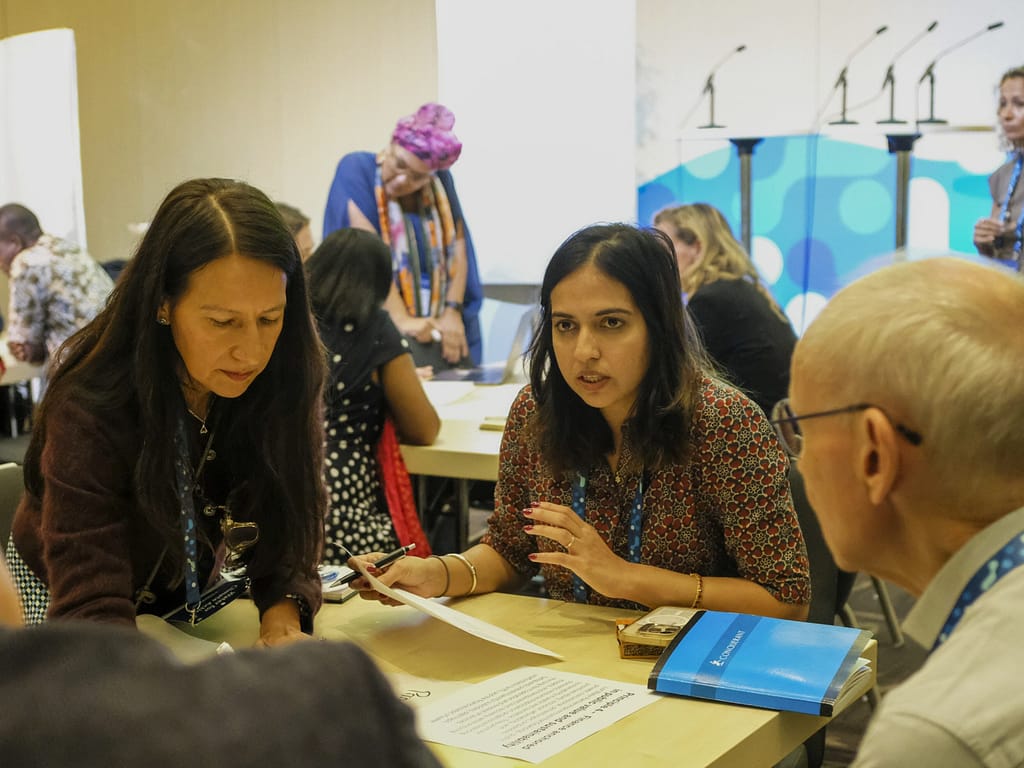 Stakeholders engaged in conversation at the “world café” sessions on the Principles for Just Water Partnerships at Stockholm World Water Week. Photo: Juliane Reissig/IWMI
