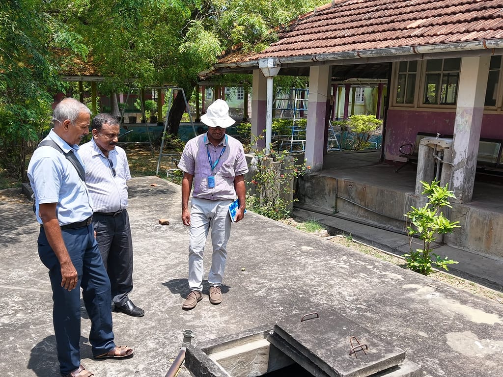 At Kytes Hospital, IWMI researchers conduct a site visit in preparation for a rainwater harvesting system. Photo: IWMI