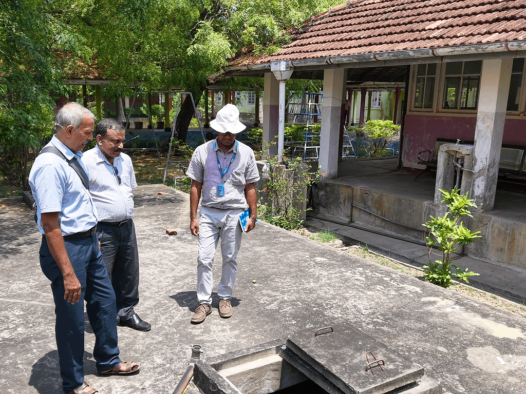 At Kytes Hospital, IWMI researchers conduct a site visit in preparation for a rainwater harvesting system. Photo: IWMI