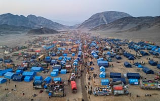 Afghan refugees are seen from above as they return from Pakistan through the Torkham border crossing in Nangarhar Province, Afghanistan, in November 2023. Photo: Waheedullah Jahesh/Shutterstock