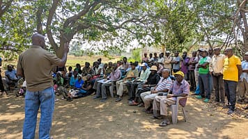 Extension Officer Edward Sichivula cautioning farmers to prepare for the risks that come with increased rainfall. Photo: Agrey Wapamesa /IWMI