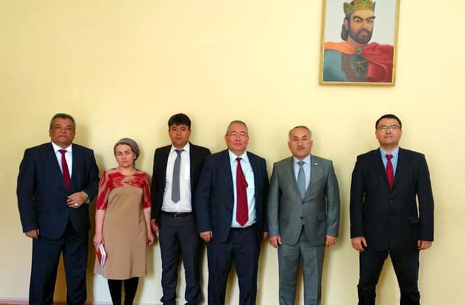 Kakhramon Djumaboev (fourth from left) and Oyture Anarbekov (first from right) stand for a group photo with the dean and faculty of the Agricultural University of Tajikistan in 2018. Photo: Agricultural University of Tajikistan.