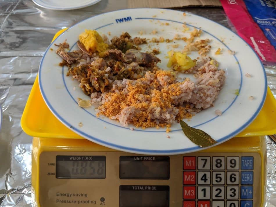 Weighing the food wasted in a canteen (Photo; Maren Reitemeier / IWMI)