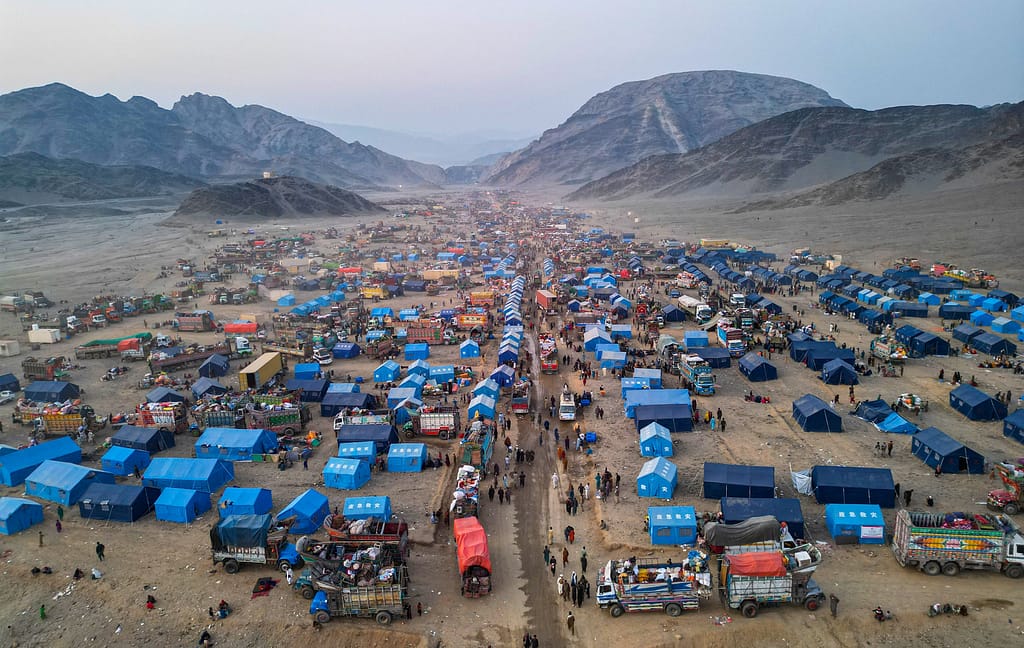 Afghan refugees are seen from above as they return from Pakistan through the Torkham border crossing in Nangarhar Province, Afghanistan, in November 2023. Photo: Waheedullah Jahesh/Shutterstock
