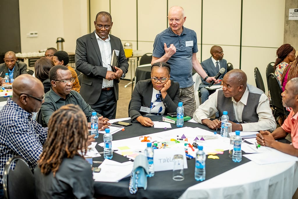 Multi Stakeholder Platform members engage in the Rapid Game Design, which enables stakeholders to use games to start conversations about basin challenges and map out practical solutions. Photo: Stephen Kakwende Photography for IWMI