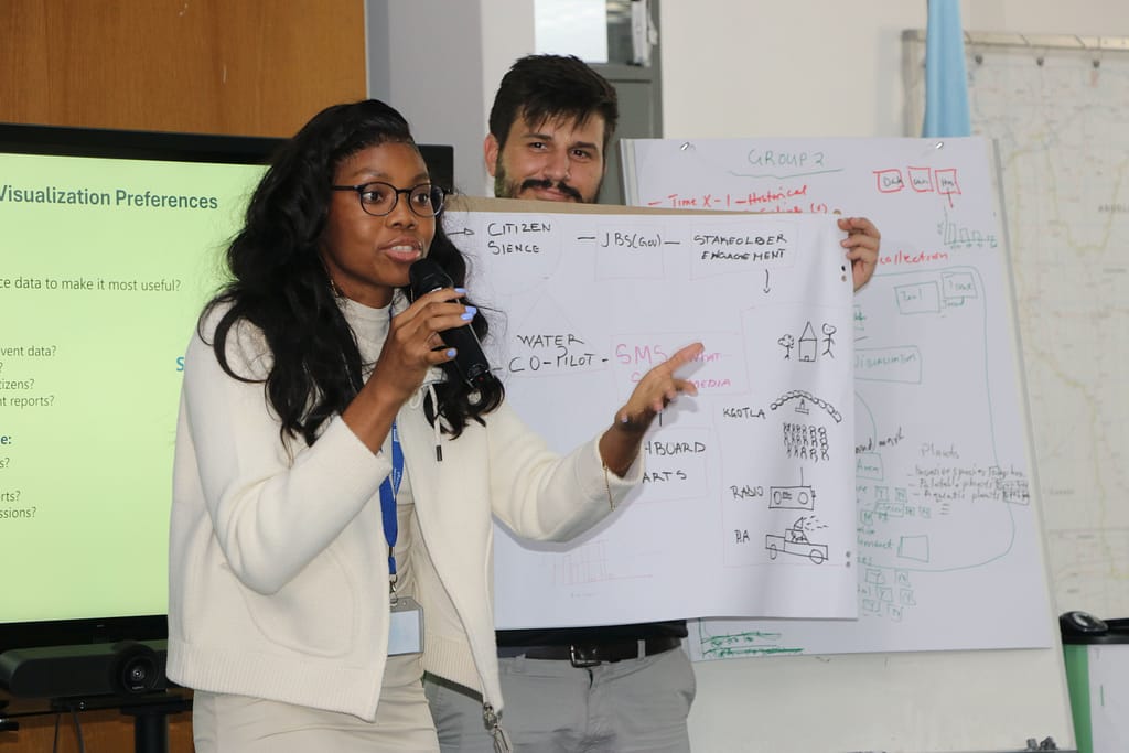 Martha Zunguze, Mozambique LIMCOM member state representative, and Hugo Campos from IWMI during a workshop session to design the integration of citizen science to the Limpopo River Basin Digital Twin (Photo: Groundtruth)