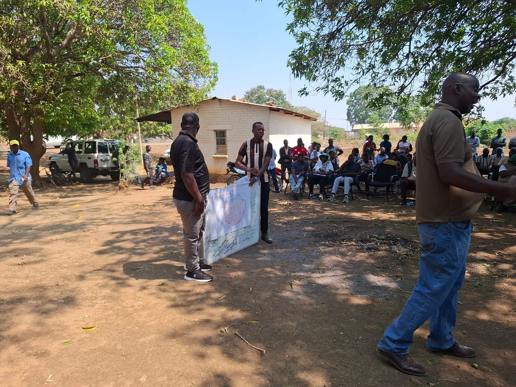 Agriculture Extension Officers are key to ensuring farmers apply best practices to managing their crops. Here they explain the 2025-2026 seasonal forecast to farmers in the Chisamba District. Photo: Agrey Wapamesa/IWMI