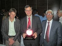 (From left to right) Matthew McCartney, Vladimir Smakhtin and Bharat Sharma with the Crystal Drop award.
