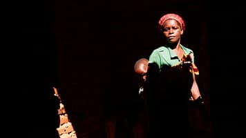 Sipiue Paulo stands with her son inside their home, which was partially destroyed by Cyclone Idai in 2019. One of the worst tropical storms to hit Southern Africa, the cyclone tore through Mozambique, Malawi and Zimbabwe, causing more than $2 billion in damage. Photo: Isabel Corthier/International Potato Center