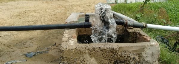 Water being pumped from a Bhungroo in Chabkha, Gujarat