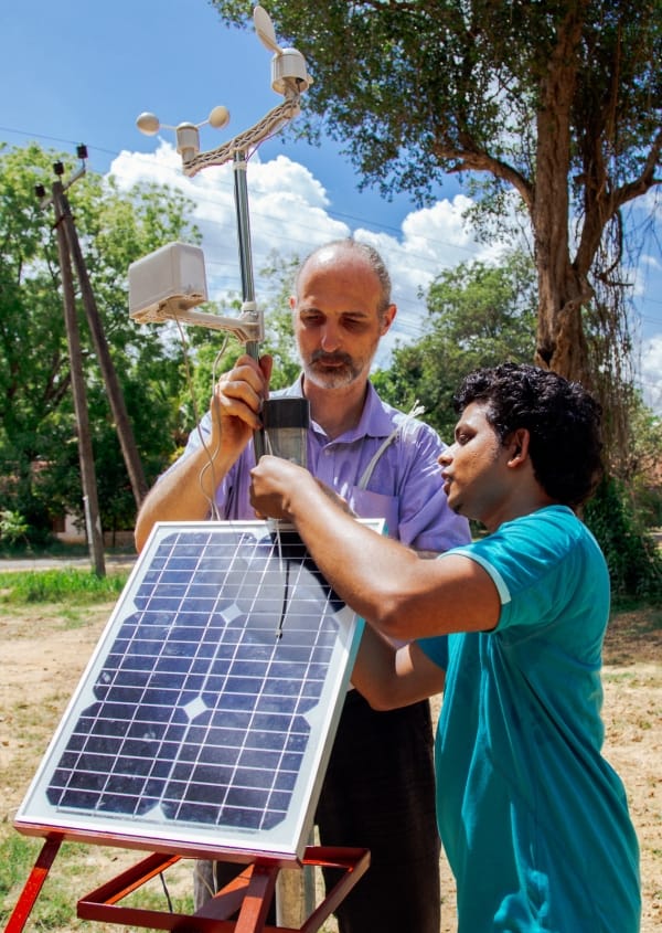 Yann Chemin and Lahiru Wijesinghe installing a weather station in the Nachchaduwa catchment