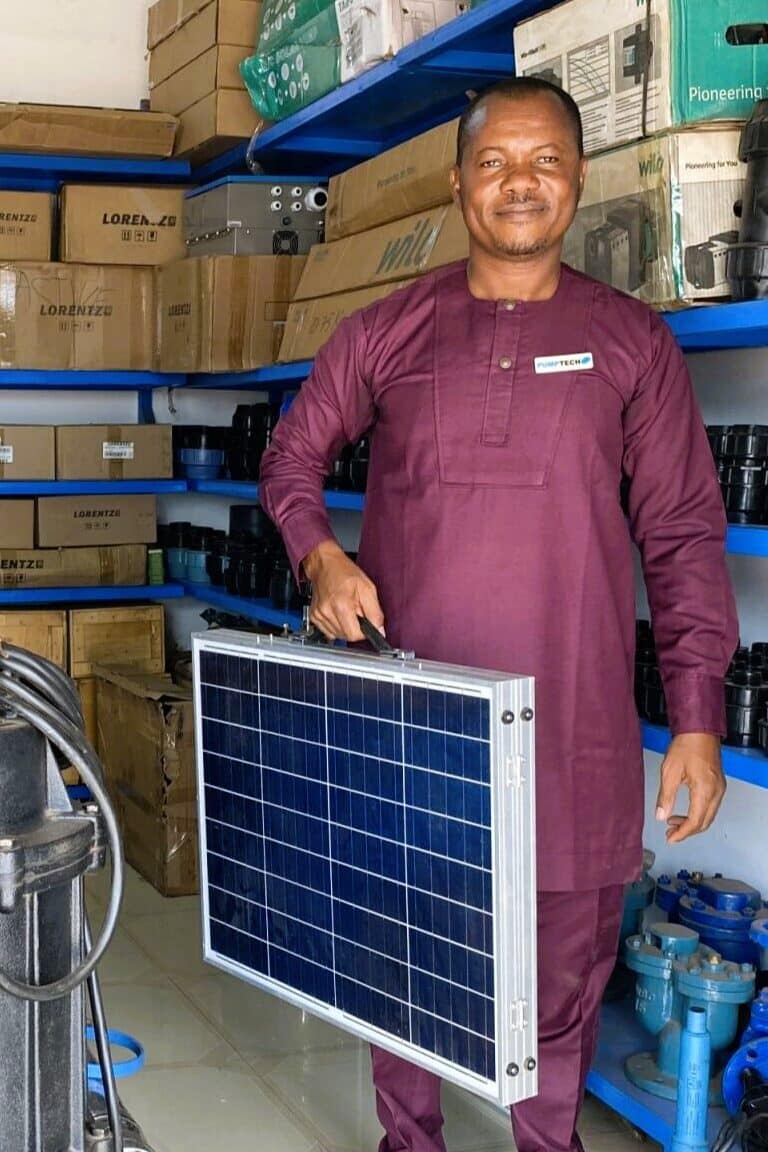 IWMI project private sector partner Pumptech, showcasing a solar-powered irrigation pump at their distribution center, in Ghana. Credit: Minh Thai/IWMI