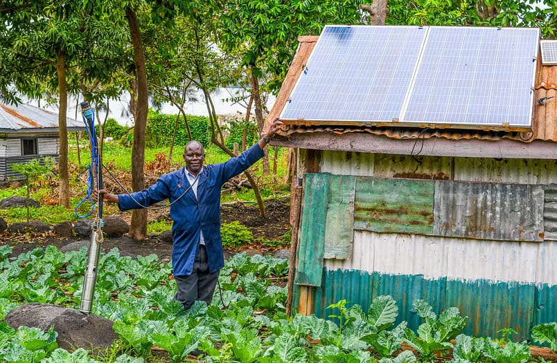 Maurice Owino, a smallholder farmer in Siaya County, Kenya, in his land. His solar-powered irrigation pump has boosted yields and increased resilience to drought. Photo: SunCulture