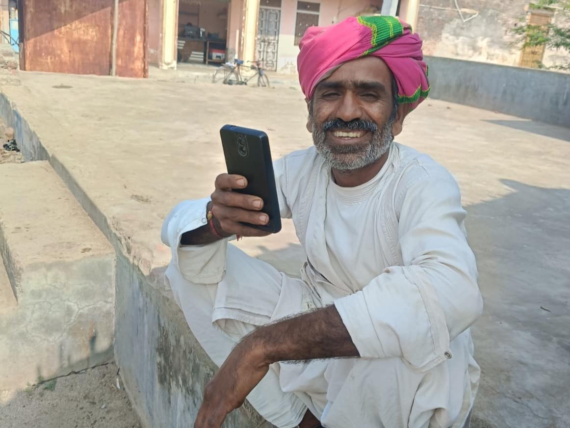 A Pani Mitra member responding to the AI-assisted WhatsApp based interview in Pali district, Rajasthan, India. Photo: Centre for Microfinance