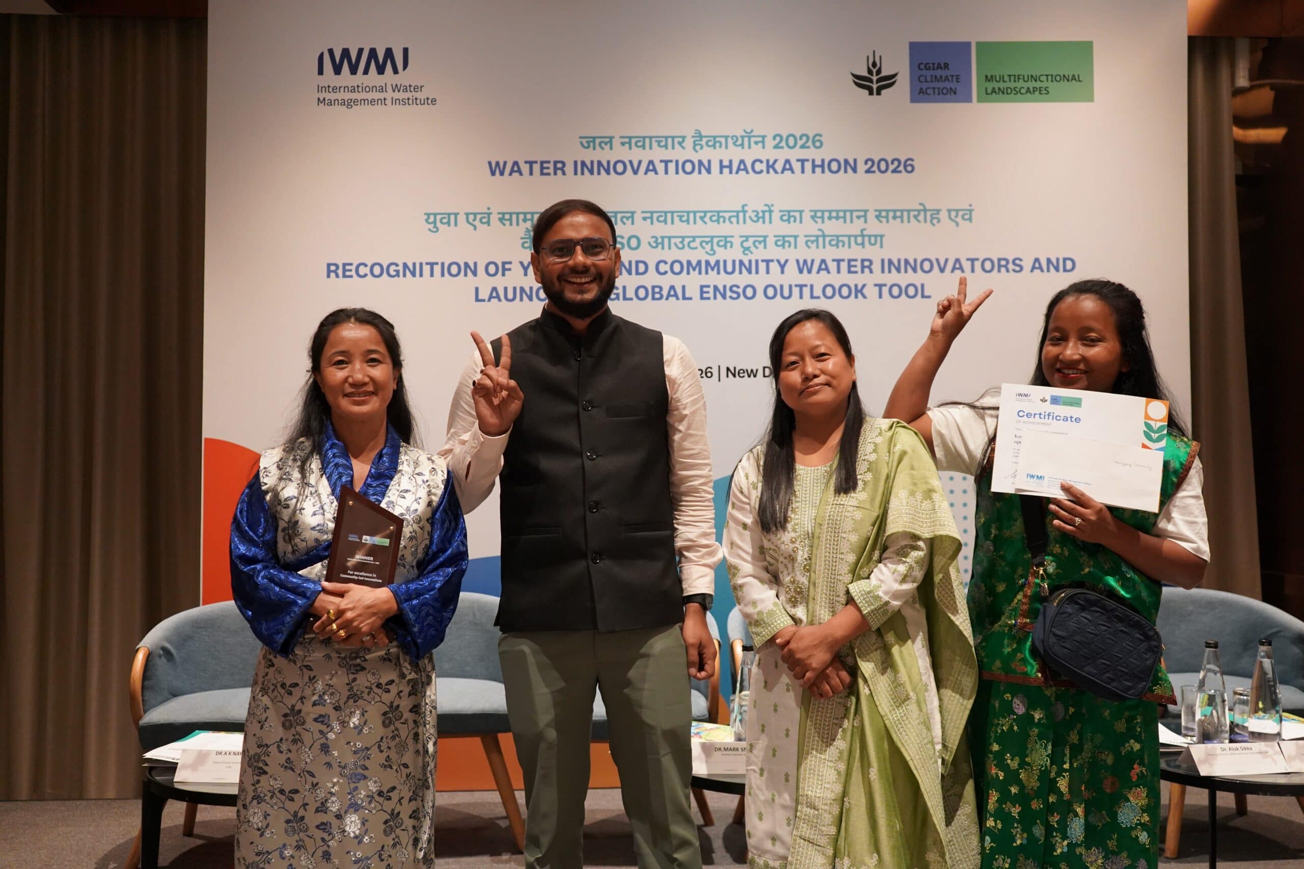 Members of the Kashyone Multipurpose Women Primary Cooperative Society Ltd. from Kalimpong, West Bengal, with their award in recognition of their outstanding work in spring rejuvenation. The cooperative was declared the winner in the Community-Led Water Management category at the Water Innovation Hackathon recognition ceremony. Photo: Tanmoy Bhaduri/IWMI