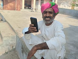 A Pani Mitra member responding to the AI-assisted WhatsApp based interview in Pali district, Rajasthan, India. Photo: Centre for Microfinance
