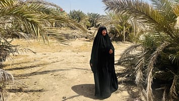 Naima Abdul Shershab, a female farmer participating in the IWMI’s Wiqaya project, stands in her village of Al-Duraan, Al-Batha District, Dhi Qar Governorate, Iraq. Photo credit: Tuqa Kadhum/ Women Empowerment Organization Iraq