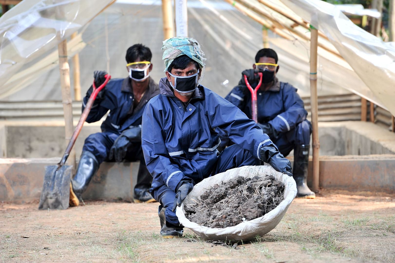 Pit latrine emptiers in Bangladesh collect and transport human waste to a site where it is processed into fertiliser. Photo: Neil Palmer / IWMI