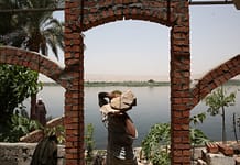Construction workers build stronger riverbanks along the Nile River to protect it from erosion. Dominic Chavez/World Bank.