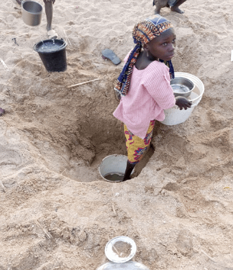 A girl fetching water at an available water source in Ketembere Village, Shelleng, LGA Adamawa State. Photo: D. Y. Giroh / IWMI 