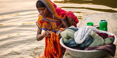A woman washes laundry at a local pond in the Sarlahi district of southern Nepal. Photo: Vision 360 for IWMI