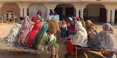 Participants learn about the water board game to help their understanding of sustainable water management practices. Photo: IWMI