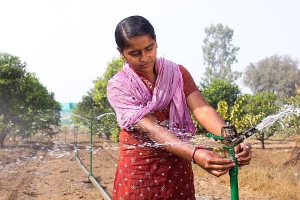 Adjusting a sprinkler, India