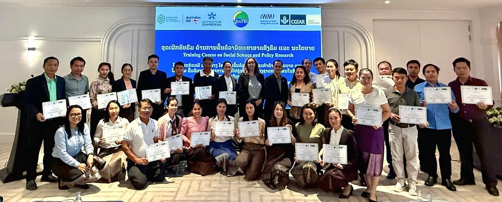 Agriculture leaders graduate from IWMI-supported research training in Lao PDR, building skills to inform national policy. Photo: NAFRI