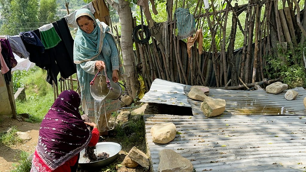 Previously, women had to walk down steep and slippery paths to the river to wash clothes. With water now stored near their homes, daily chores can be done safely and easily. Photo: Amjad Jamal/IWMI