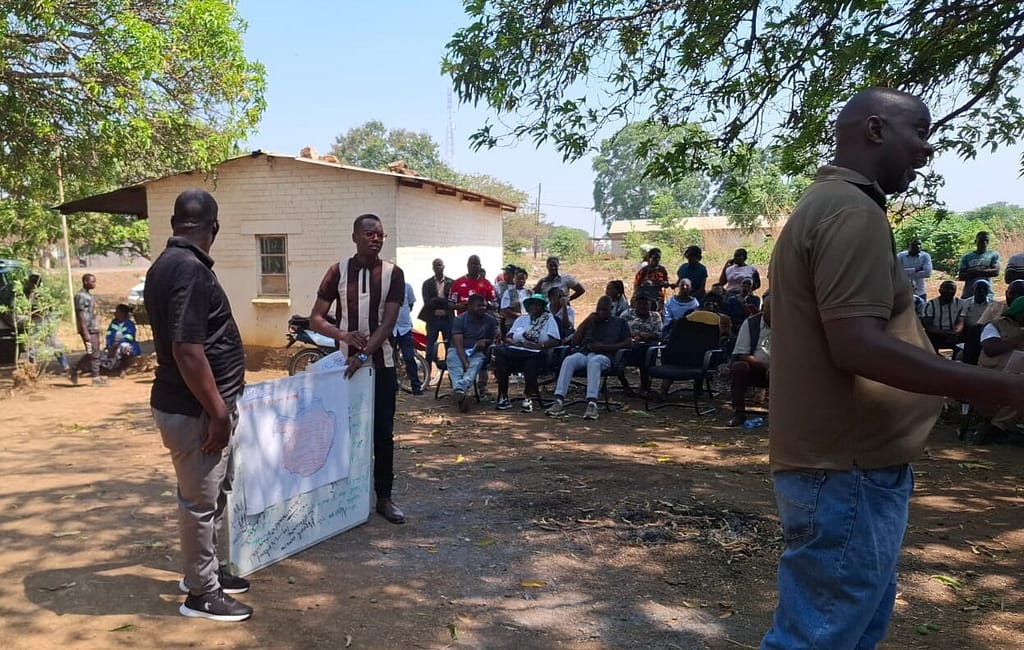 Agriculture Extension Officers are key to ensuring farmers apply best practices to managing their crops. Here they explain the 2025-2026 seasonal forecast to farmers in the Chisamba District. Photo: Agrey Wapamesa/IWMI